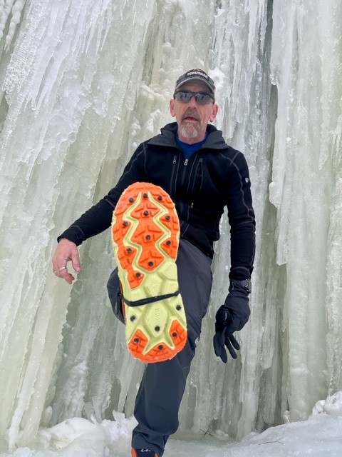 Gary from MI wearing IceSpikes at Eben Ice Caves